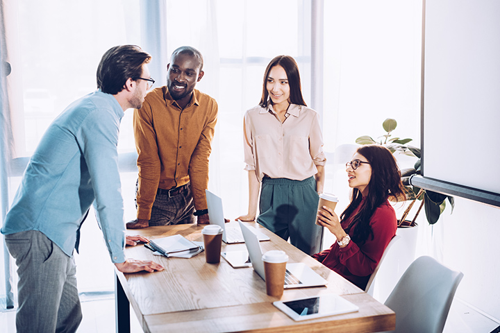 Workers at a conference room meeting