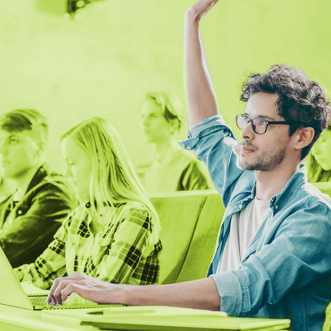 Young professional raising his hand in the classroom