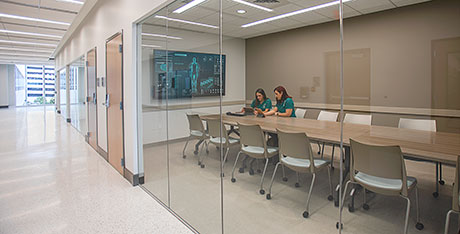 Two students studying inside lab