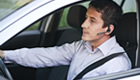 Man sitting in car on driving range course